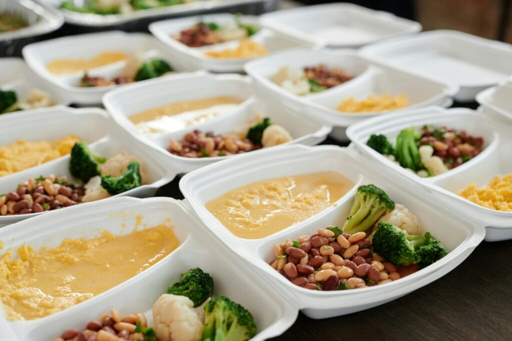Delicious and nutritious meal prep featuring broccoli, beans, and eggs in containers.
