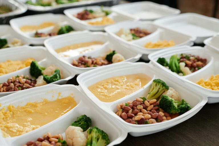 Delicious and nutritious meal prep featuring broccoli, beans, and eggs in containers.